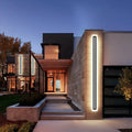 Modern house exterior with illuminated facade at night