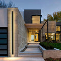 Modern house exterior with illuminated steps and facade