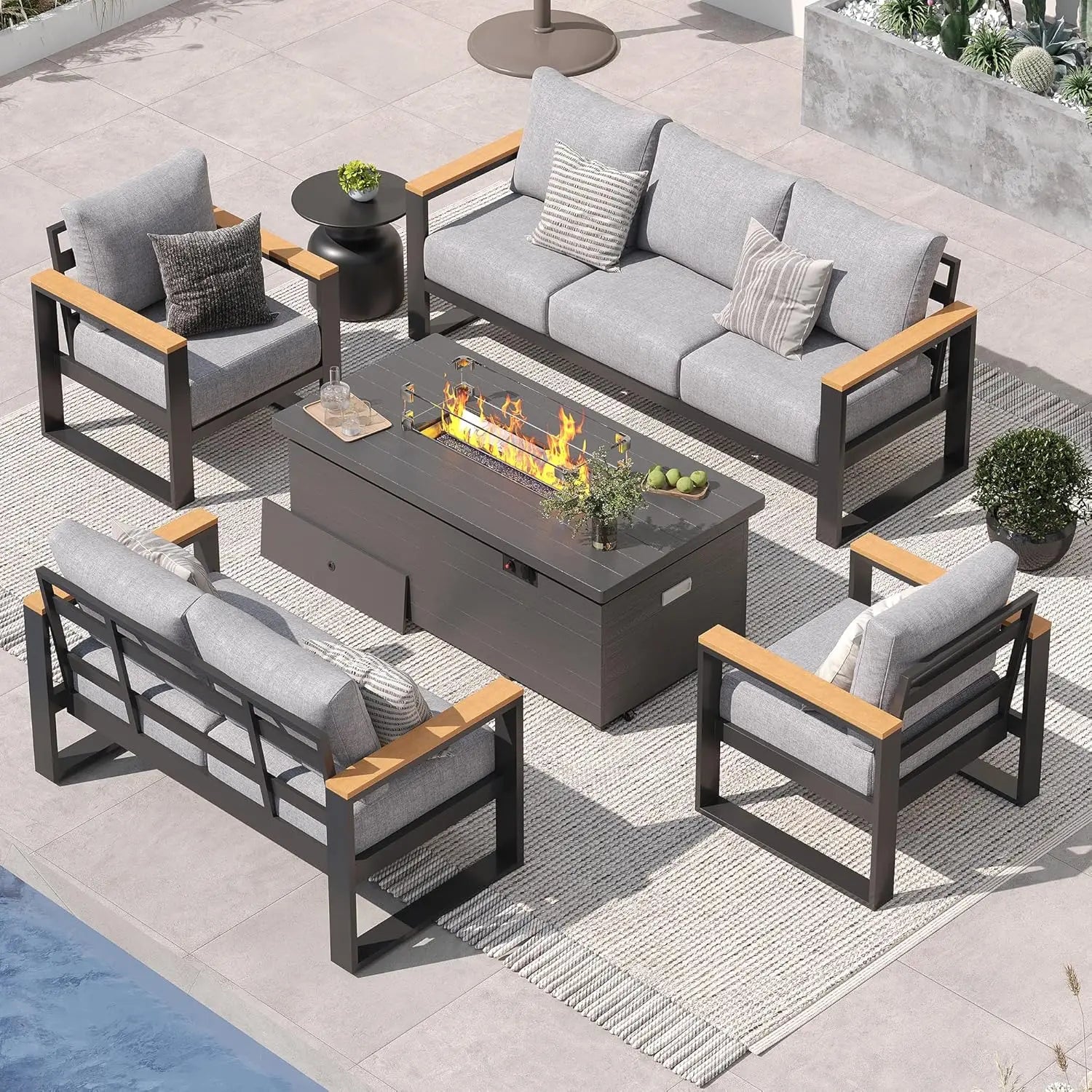 Outdoor patio furniture set with fire pit table on a patio.
