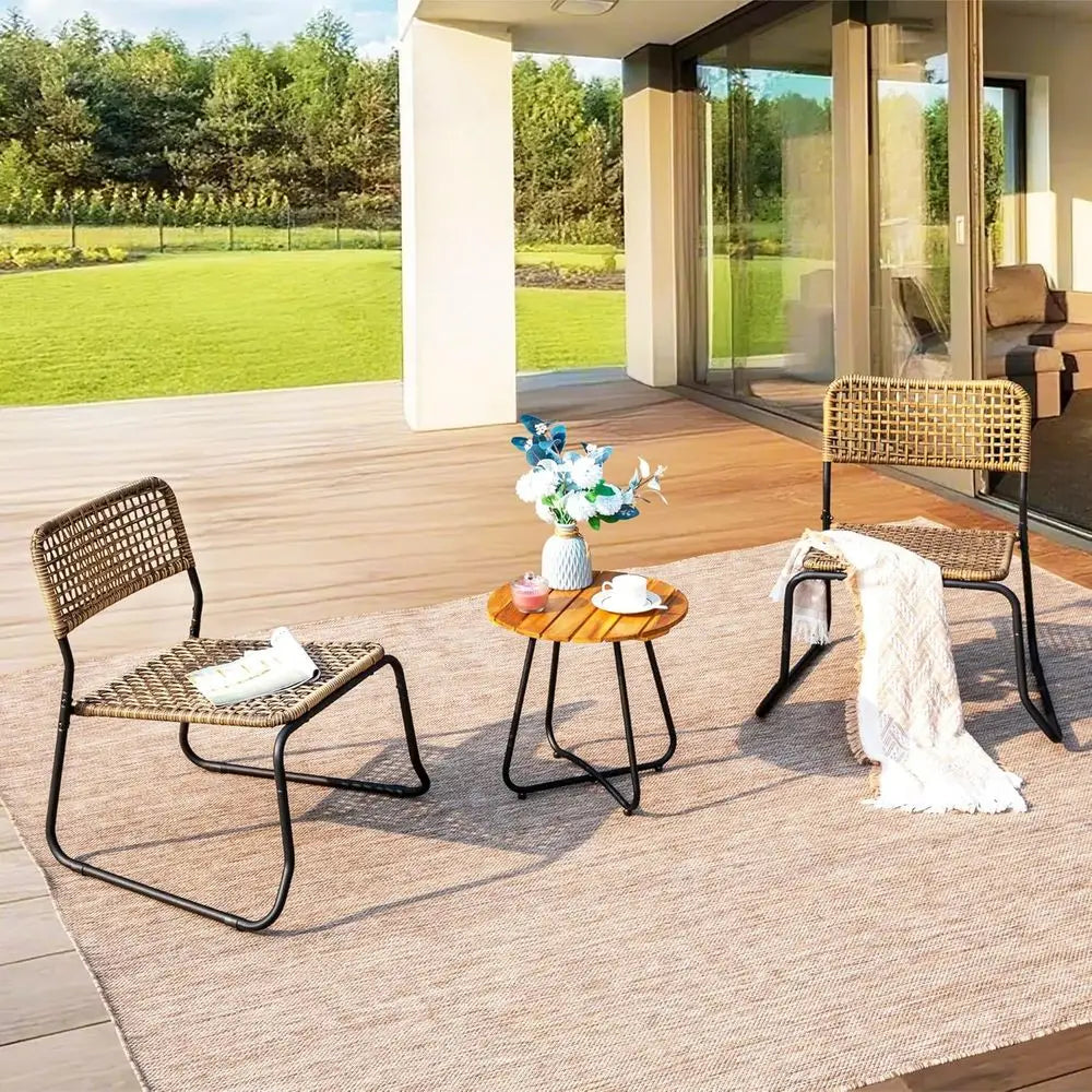 Outdoor patio setting with two chairs and a small table on a deck.